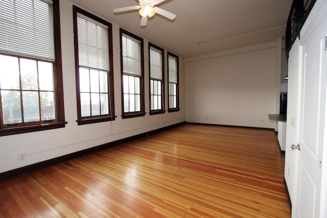 301 Central Ave NE Unit 202, Albuquerque, NM 87102 - empty room with ceiling fan, light wood-style flooring, and baseboards