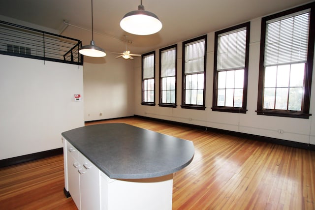 301 Central Ave NE Unit 202, Albuquerque, NM 87102 - playroom with light wood-style floors, baseboards, and ceiling fan