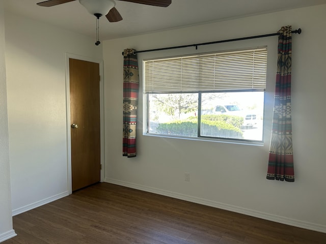 2833 Tiffany Rd, Tucumcari, NM 88401 - unfurnished room featuring wood finished floors, healthy amount of natural light, a ceiling fan, and baseboards