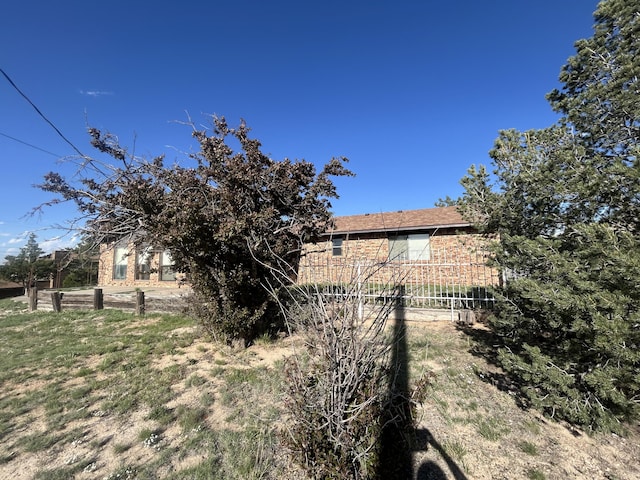 2833 Tiffany Rd, Tucumcari, NM 88401 - view of home's exterior featuring brick siding