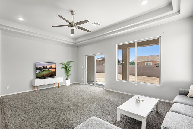 6 Margarita Cir, Los Lunas, NM 87031 - living room featuring a raised ceiling, a ceiling fan, recessed lighting, and carpet