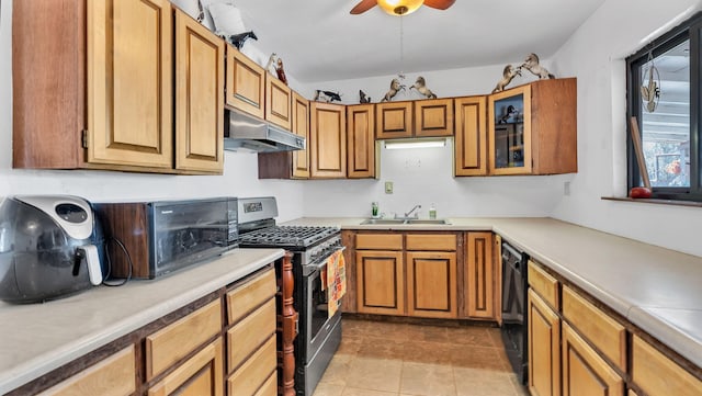 84 Fire Station Rd, Los Lunas, NM 87031 - kitchen with under cabinet range hood, stainless steel gas range oven, dishwasher, ceiling fan, and a sink