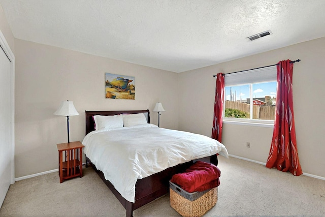 8224 Bret Pl NE, Albuquerque, NM 87109 - bedroom with carpet, baseboards, and a textured ceiling