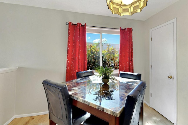 8224 Bret Pl NE, Albuquerque, NM 87109 - dining space featuring light wood-style floors and baseboards