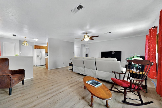 8224 Bret Pl NE, Albuquerque, NM 87109 - living room featuring ceiling fan, light wood-type flooring, and baseboards