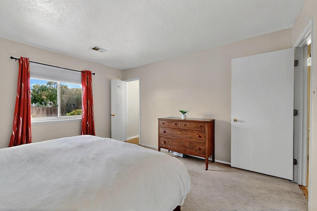8224 Bret Pl NE, Albuquerque, NM 87109 - bedroom featuring light carpet, baseboards, and a textured ceiling