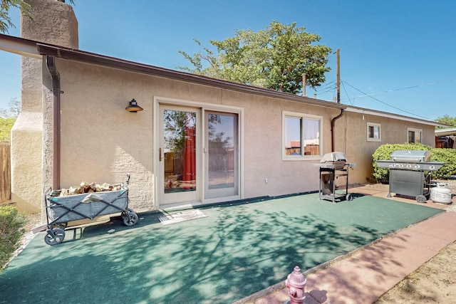 8224 Bret Pl NE, Albuquerque, NM 87109 - back of property featuring stucco siding and a patio