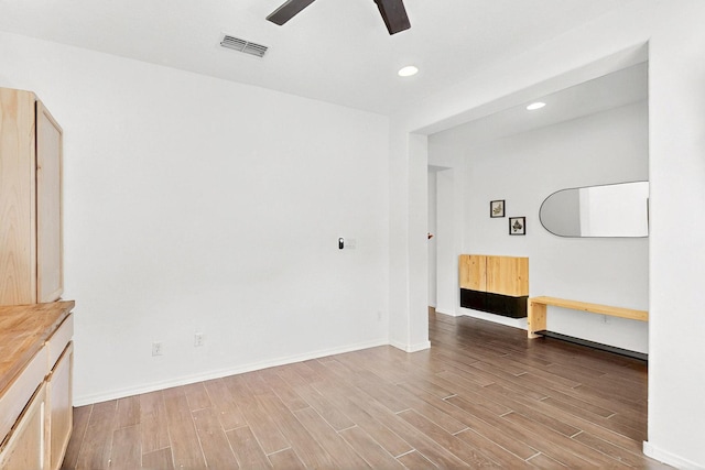 1605 Copper Mountain Trl NW, Albuquerque, NM 87120 - spare room featuring wood finished floors, a ceiling fan, baseboards, and recessed lighting