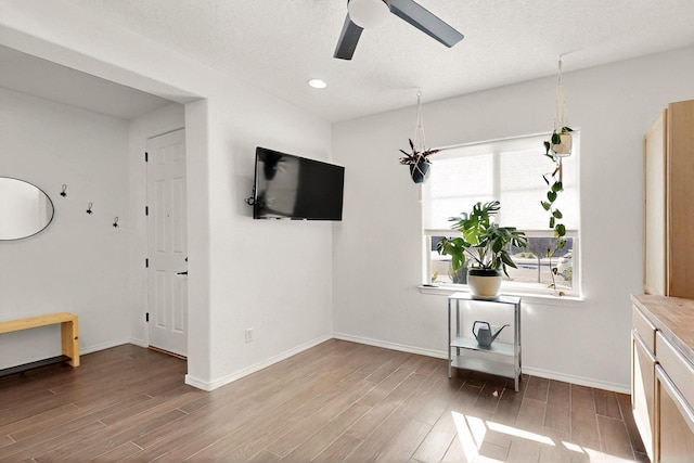 1605 Copper Mountain Trl NW, Albuquerque, NM 87120 - unfurnished dining area with wood finished floors, a ceiling fan, baseboards, and recessed lighting