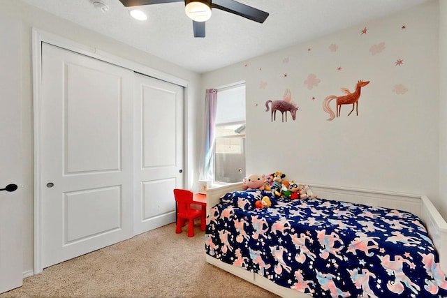 1605 Copper Mountain Trl NW, Albuquerque, NM 87120 - bedroom with carpet floors, a closet, and ceiling fan