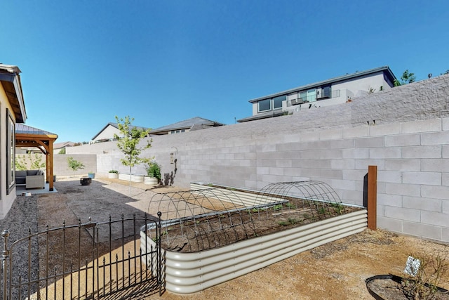1605 Copper Mountain Trl NW, Albuquerque, NM 87120 - fenced backyard with a garden and a patio area