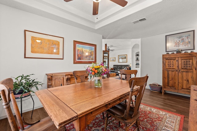 3827 Fox Sparrow Trl NW, Albuquerque, NM 87120 - dining area with a ceiling fan, wood finished floors, and a raised ceiling