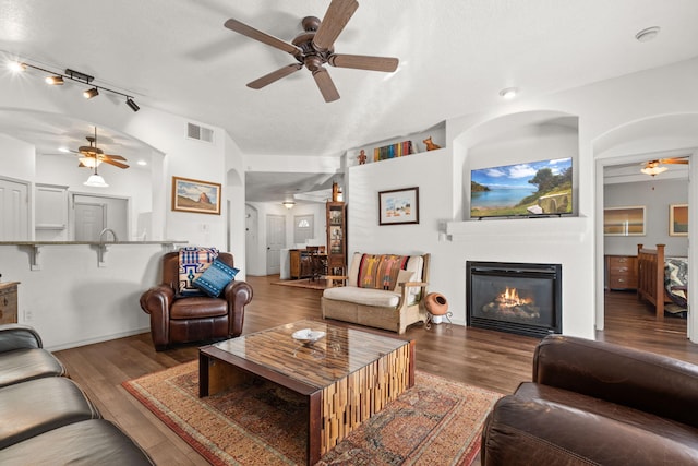 3827 Fox Sparrow Trl NW, Albuquerque, NM 87120 - living area with a ceiling fan, a glass covered fireplace, and wood finished floors