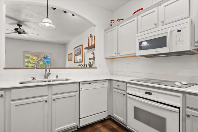 3827 Fox Sparrow Trl NW, Albuquerque, NM 87120 - kitchen with white appliances, a sink, light countertops, dark wood-type flooring, and a ceiling fan