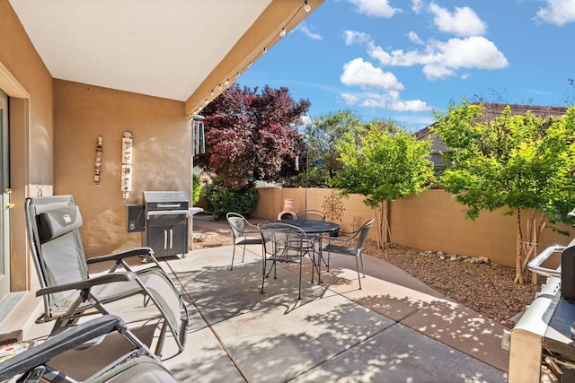 3827 Fox Sparrow Trl NW, Albuquerque, NM 87120 - fenced backyard with outdoor dining space, a patio, and area for grilling
