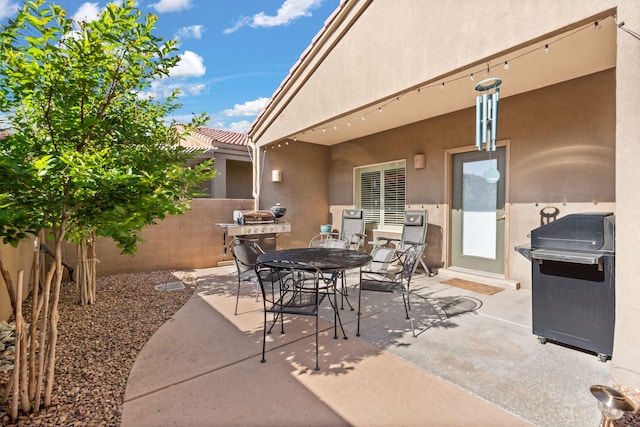 3827 Fox Sparrow Trl NW, Albuquerque, NM 87120 - view of patio / terrace featuring outdoor dining space and grilling area