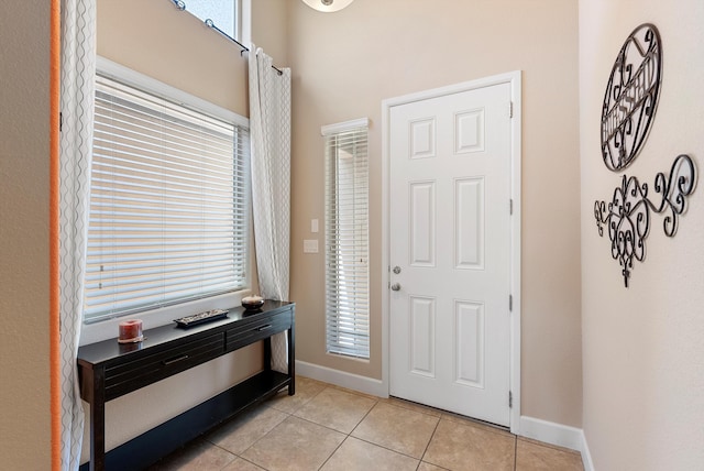 2659 Vista Manzano Loop NE, Rio Rancho, NM 87144 - entrance foyer featuring light tile patterned flooring, healthy amount of natural light, and baseboards