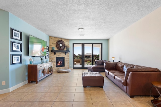 2659 Vista Manzano Loop NE, Rio Rancho, NM 87144 - living area featuring light tile patterned flooring, a fireplace, a textured ceiling, and baseboards