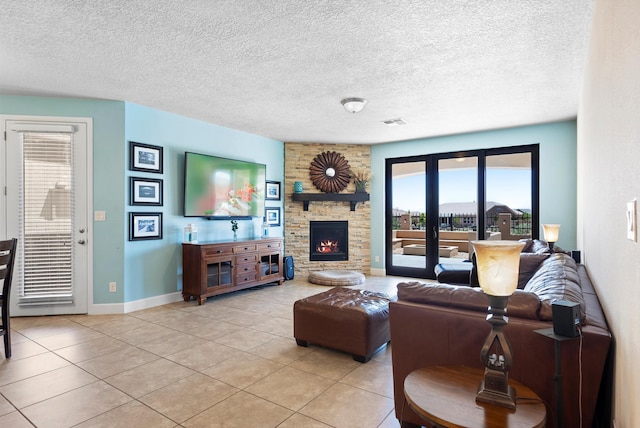 2659 Vista Manzano Loop NE, Rio Rancho, NM 87144 - living room with light tile patterned floors, healthy amount of natural light, a fireplace, baseboards, and a textured ceiling