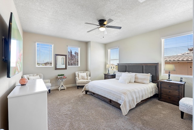 2659 Vista Manzano Loop NE, Rio Rancho, NM 87144 - carpeted bedroom featuring a textured ceiling, baseboards, and a ceiling fan