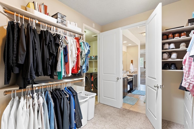 2659 Vista Manzano Loop NE, Rio Rancho, NM 87144 - walk in closet featuring light colored carpet and light tile patterned flooring