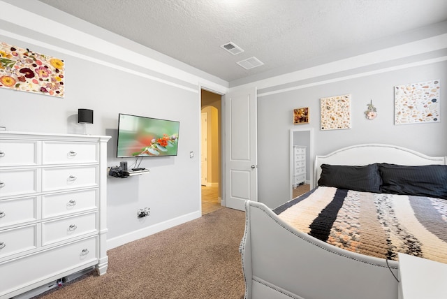 2659 Vista Manzano Loop NE, Rio Rancho, NM 87144 - bedroom with a textured ceiling, carpet floors, and baseboards