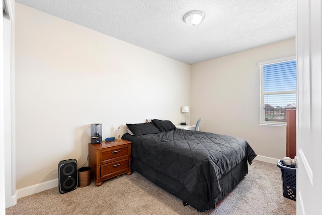 2659 Vista Manzano Loop NE, Rio Rancho, NM 87144 - bedroom with light carpet, a textured ceiling, and baseboards