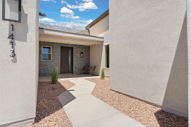1413 6th St SE, Rio Rancho, NM 87124 - view of exterior entry with a patio area and stucco siding
