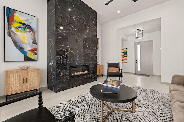 1413 6th St SE, Rio Rancho, NM 87124 - living room featuring tile patterned flooring, a premium fireplace, ceiling fan, baseboards, and recessed lighting