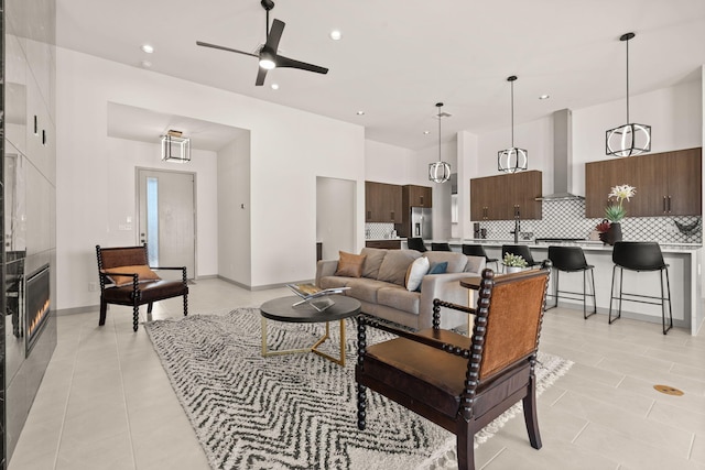 1413 6th St SE, Rio Rancho, NM 87124 - living area featuring light tile patterned floors, recessed lighting, a ceiling fan, and baseboards