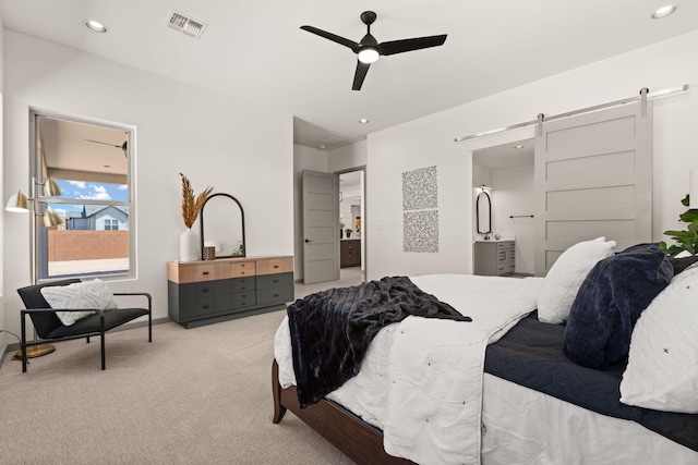 1413 6th St SE, Rio Rancho, NM 87124 - carpeted bedroom featuring a barn door, recessed lighting, and ceiling fan