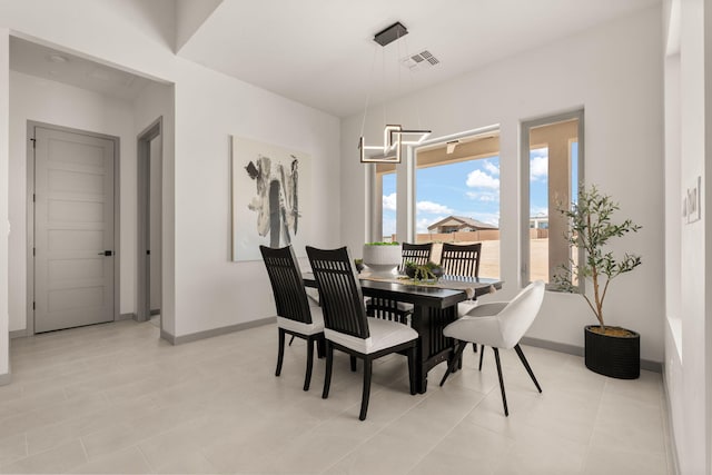 1413 6th St SE, Rio Rancho, NM 87124 - dining area with baseboards and a chandelier