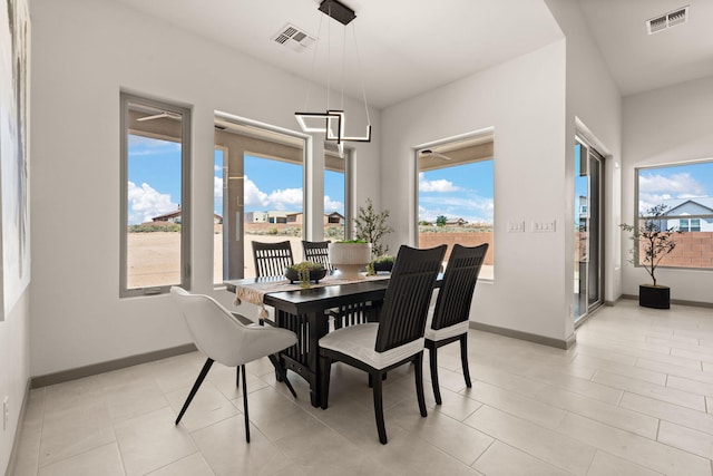 1413 6th St SE, Rio Rancho, NM 87124 - dining room with baseboards and light tile patterned flooring