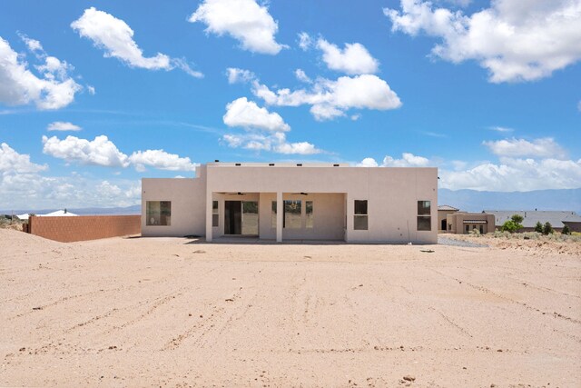1413 6th St SE, Rio Rancho, NM 87124 - back of house with stucco siding, a patio, and ceiling fan