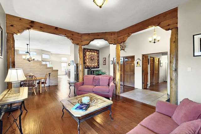 6500 Moon Shadows Dr NW, Albuquerque, NM 87120 - living area featuring a chandelier, wood-type flooring, beam ceiling, and stairs