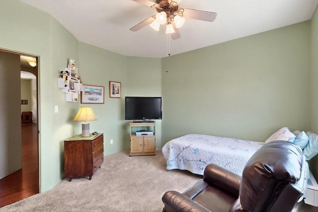 6500 Moon Shadows Dr NW, Albuquerque, NM 87120 - bedroom with light carpet, a ceiling fan, and arched walkways
