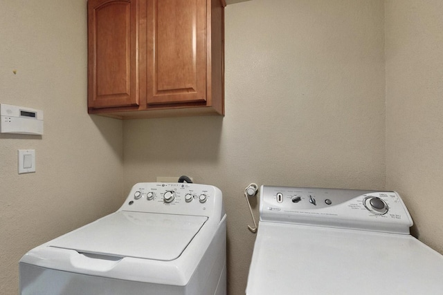 6500 Moon Shadows Dr NW, Albuquerque, NM 87120 - laundry room with cabinet space and washer and clothes dryer