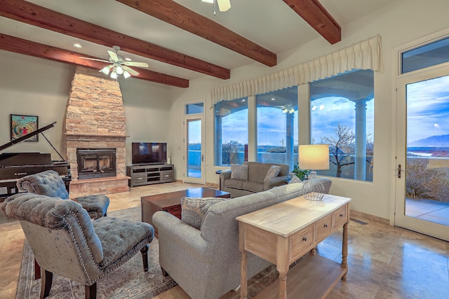 4110 Waterwillow Pl NW, Albuquerque, NM 87120 - living room featuring ceiling fan, beam ceiling, and a stone fireplace