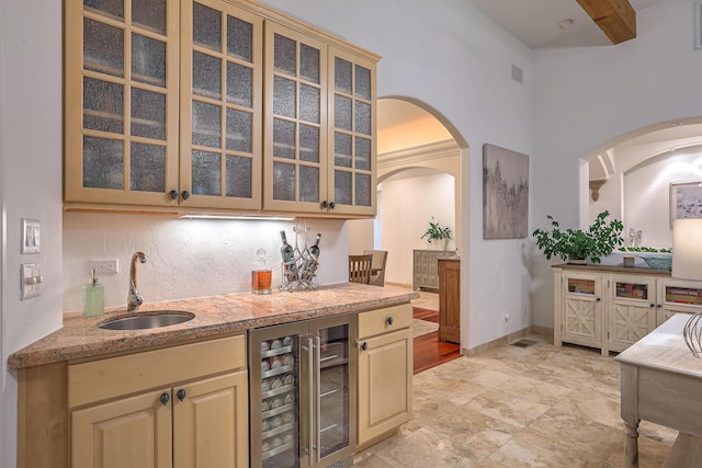 4110 Waterwillow Pl NW, Albuquerque, NM 87120 - indoor wet bar with wine cooler, arched walkways, and beamed ceiling