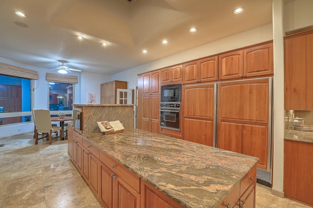 4110 Waterwillow Pl NW, Albuquerque, NM 87120 - kitchen with oven, black microwave, recessed lighting, ceiling fan, and brown cabinets