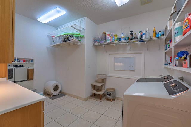 4110 Waterwillow Pl NW, Albuquerque, NM 87120 - laundry area featuring washing machine and clothes dryer, light tile patterned floors, and cabinet space