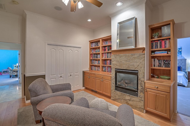 4110 Waterwillow Pl NW, Albuquerque, NM 87120 - living area with light wood-type flooring, ornamental molding, ceiling fan, a high end fireplace, and recessed lighting