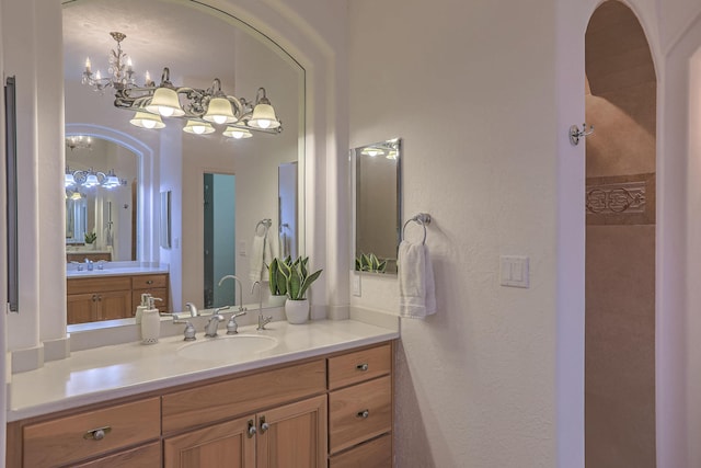 4110 Waterwillow Pl NW, Albuquerque, NM 87120 - full bath with vanity, a chandelier, and a textured wall