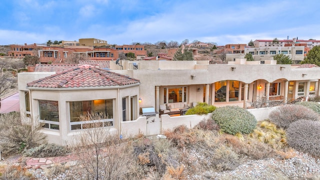 4110 Waterwillow Pl NW, Albuquerque, NM 87120 - back of house featuring a residential view, stucco siding, and a tiled roof