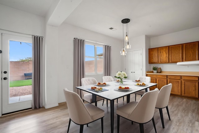 3702 Buckskin Loop NE, Rio Rancho, NM 87144 - dining area featuring light wood finished floors