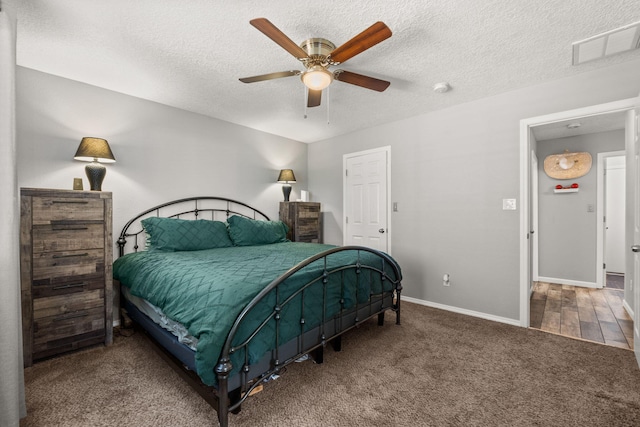 1227 Desert Paintbrush Loop, Rio Rancho, NM 87144 - carpeted bedroom with baseboards, a textured ceiling, and a ceiling fan