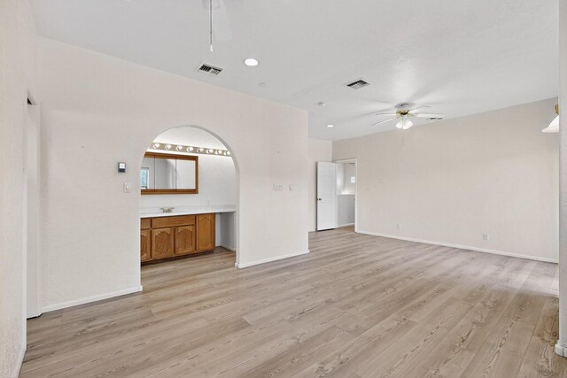 2517 Georgene Dr NE, Albuquerque, NM 87112 - bathroom featuring wood finished floors, vanity, and a textured wall