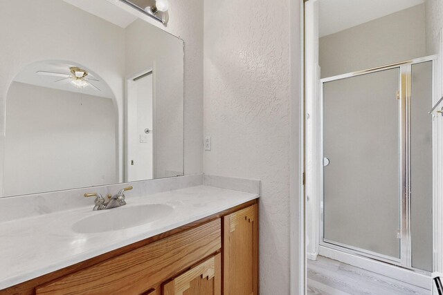 2517 Georgene Dr NE, Albuquerque, NM 87112 - unfurnished living room with a ceiling fan, a baseboard heating unit, wood finished floors, and recessed lighting