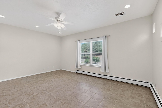 2517 Georgene Dr NE, Albuquerque, NM 87112 - spare room with a baseboard heating unit, a ceiling fan, and recessed lighting
