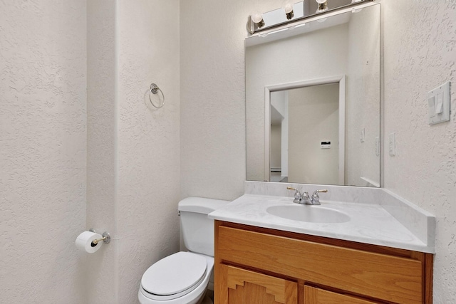 2517 Georgene Dr NE, Albuquerque, NM 87112 - bathroom featuring a textured wall and vanity